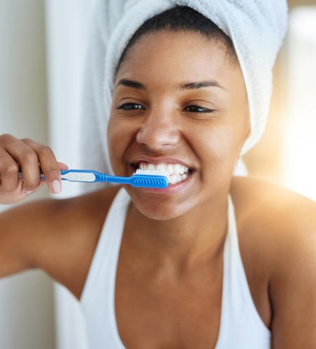 Woman brushing her teeth